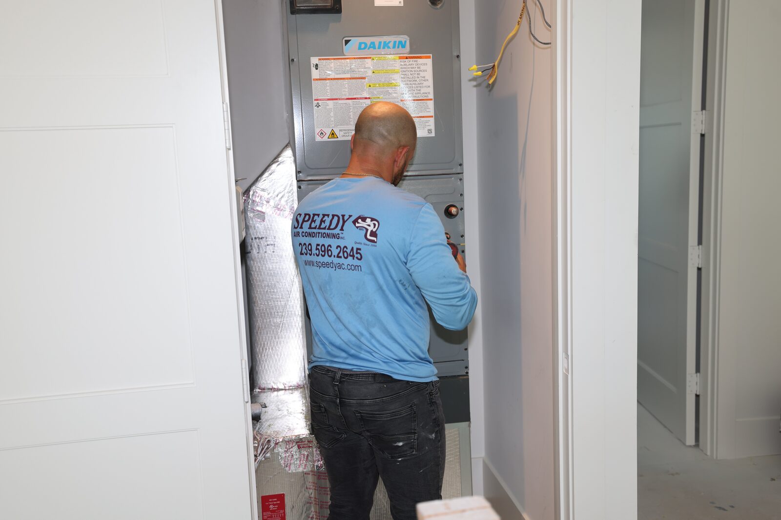 Servicing a Daikin indoor air handler in a new-construction closet