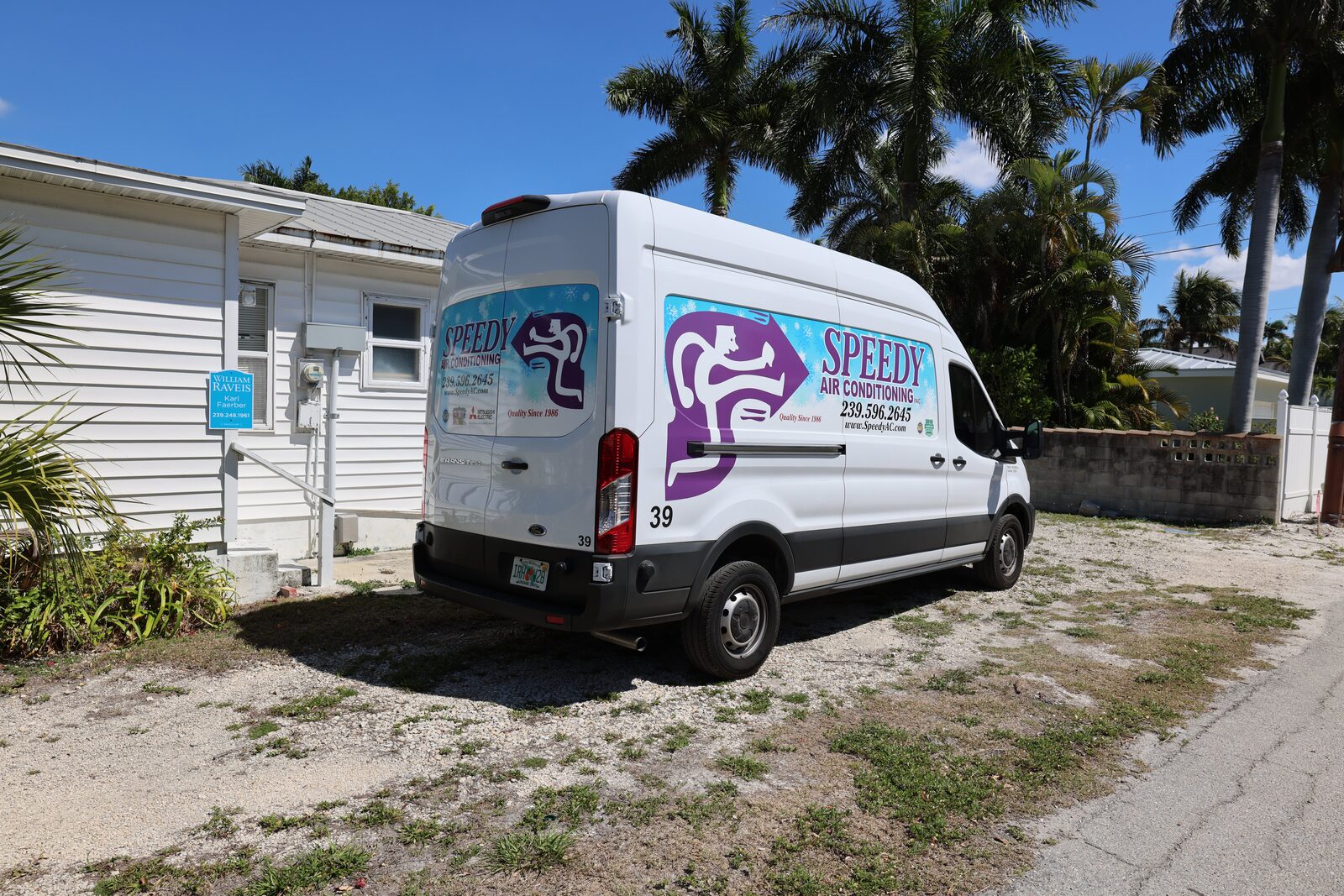 Van 39 parked on a Naples driveway between calls